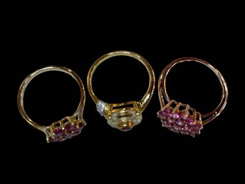Three 9 carat gold and pink gemstone rings. thumbnail