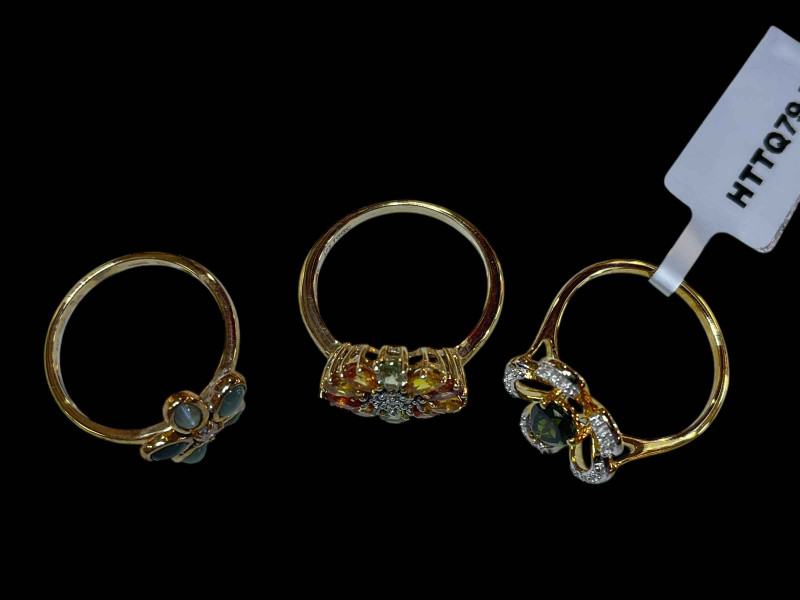 Three 9 carat gold and gem set dress rings.