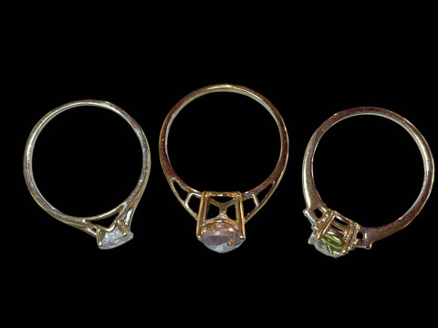 Three 9 carat gold and gem set rings. thumbnail
