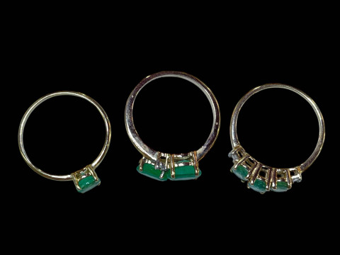 Three 9 carat gold and green gem set dress rings. thumbnail