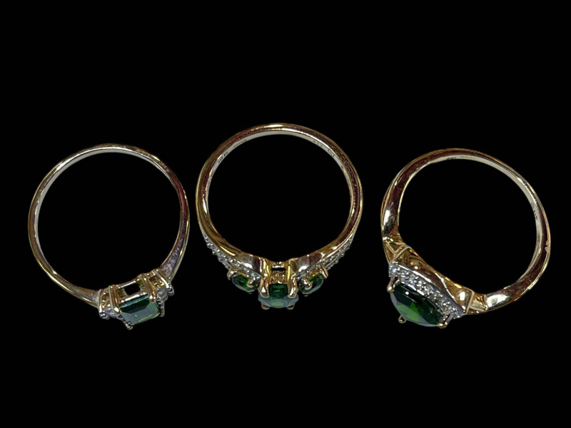 Three 9 carat gold, diopside and diamond rings.