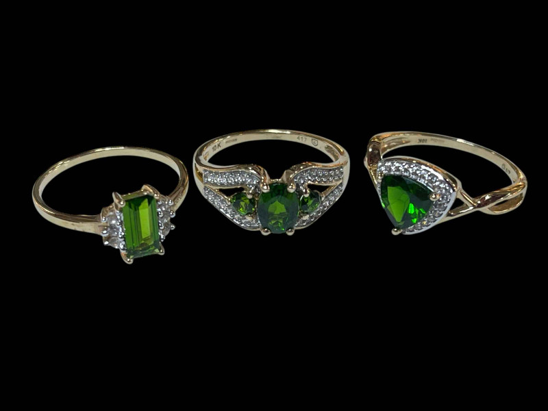 Three 9 carat gold, diopside and diamond rings.