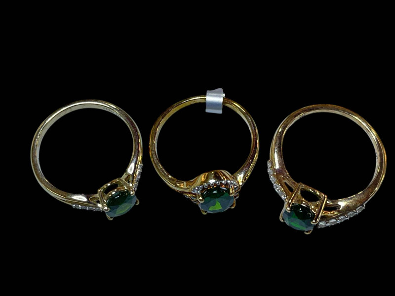 Three 9 carat gold, diopside and diamond rings.