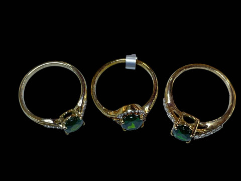 Three 9 carat gold, diopside and diamond rings. thumbnail