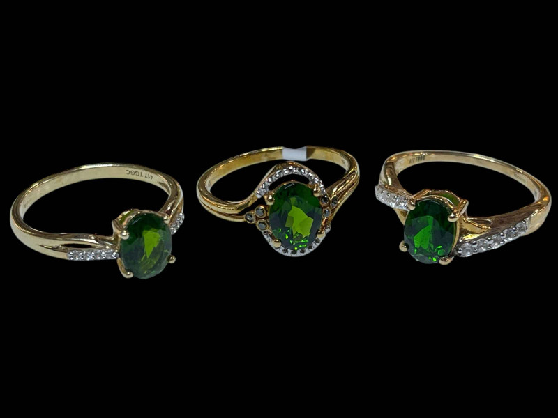 Three 9 carat gold, diopside and diamond rings.