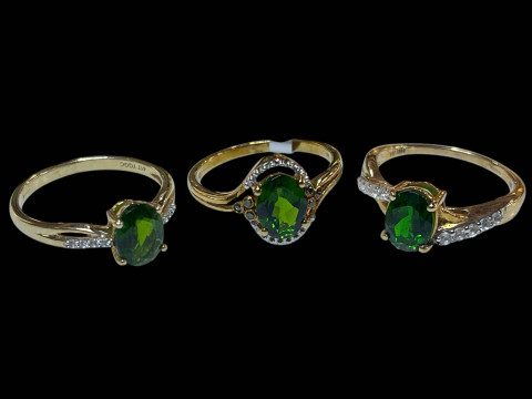 Three 9 carat gold, diopside and diamond rings.