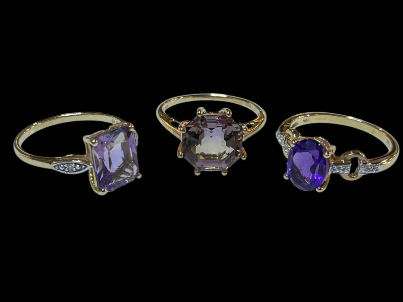 Amethyst and diamond 9 carat gold ring, and two dress rings.