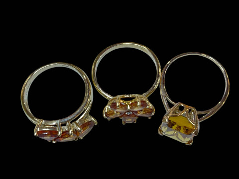 Three 9 carat gold gem set rings. thumbnail