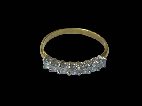 18 carat yellow gold and diamond seven stone ring, size N.