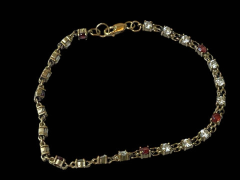 9 carat gold gem set bracelet.