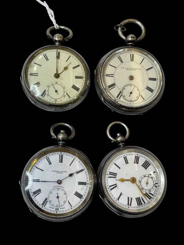Collection of four silver pocket watches including Waltham, J & JE Wilkinson and Harris Stone.