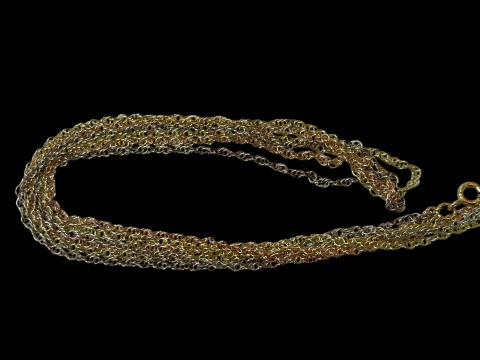 Three strand necklace comprising 9 carat gold, silver and rose gold strands.