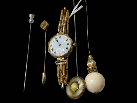 9 carat gold watch with enamel dial, three hat pins and tie pin.
