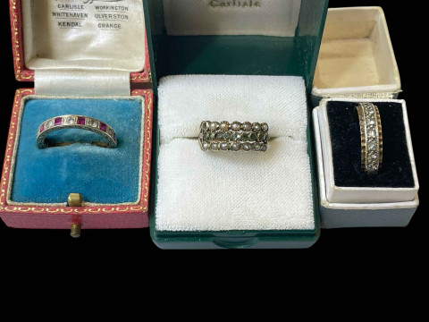 Two eternity rings and pearl and gem set ring.