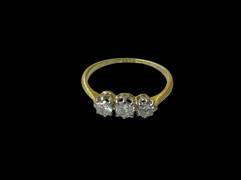 Diamond three stone 18 carat gold and platinum ring, size I.