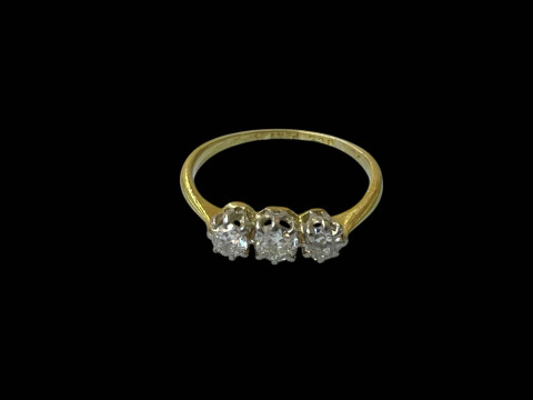 Diamond three stone 18 carat gold and platinum ring, size I.