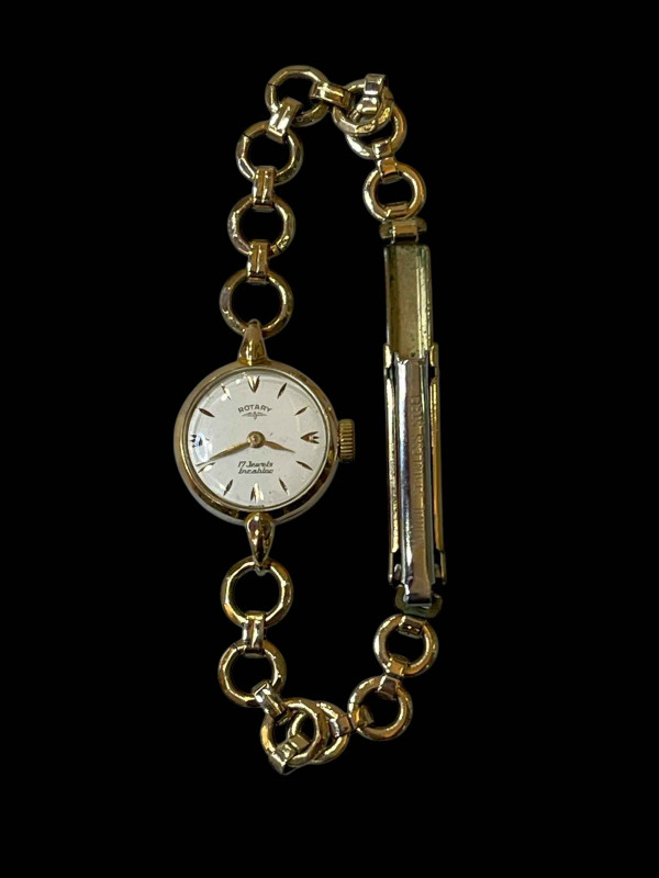 Ladies 18 carat gold Rotary wristwatch with rolled gold strap.