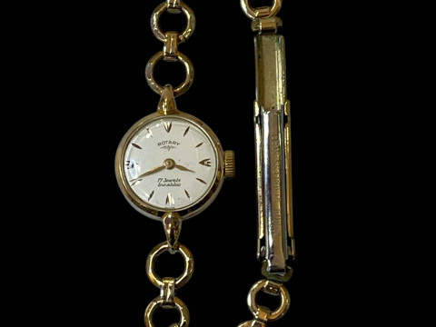 Ladies 18 carat gold Rotary wristwatch with rolled gold strap.