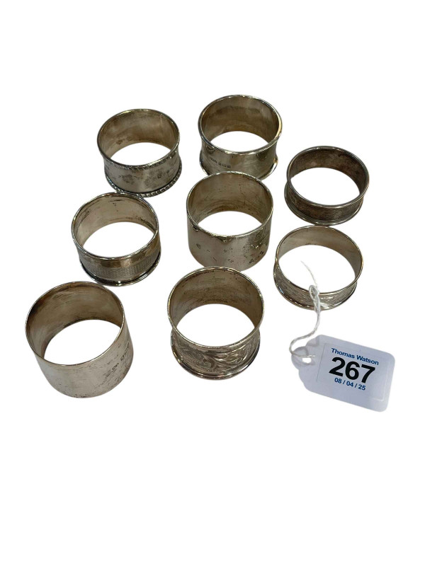 Collection of eight silver napkin rings.