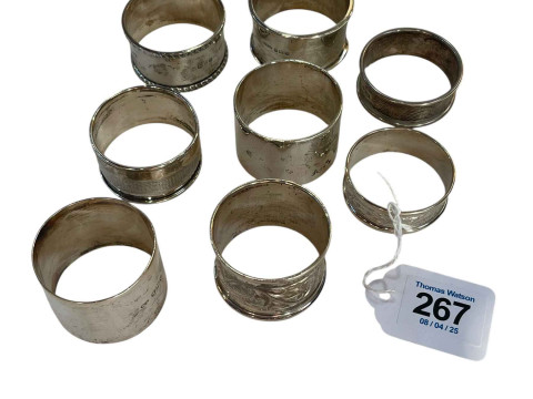 Collection of eight silver napkin rings.