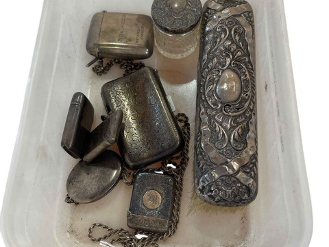 Silver cigarette case, four silver vestas, locket and chain, silver backed...