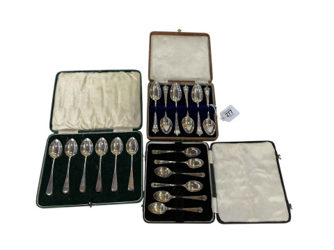 Three cased sets of silver spoons.
