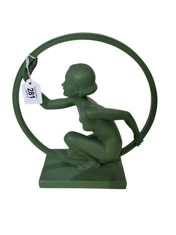 Art Deco design green pottery figure of dancer with large hoop with monogrammed initials and registration number.