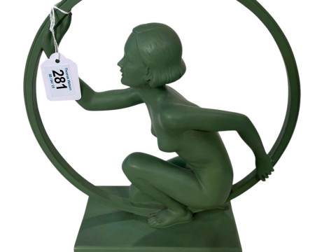 Art Deco design green pottery figure of dancer with large hoop with monogrammed...