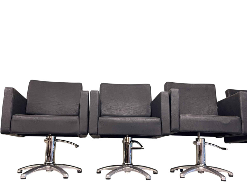 Set of seven Lotus hydraulic swivel salon chairs.