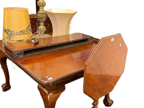 Edwardian mahogany extending dining table on ball and claw feet with two...