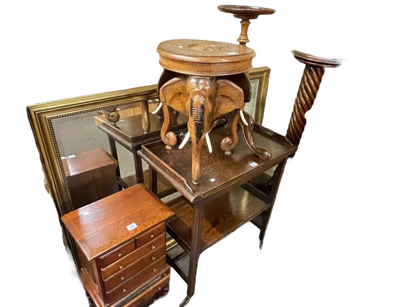Oak mini chest of two short above four long drawers, carved hardwood elephant stool, tripod wine table, twist column torchere, gilt framed bevelled wall mirror and oak fold top trolley (6).