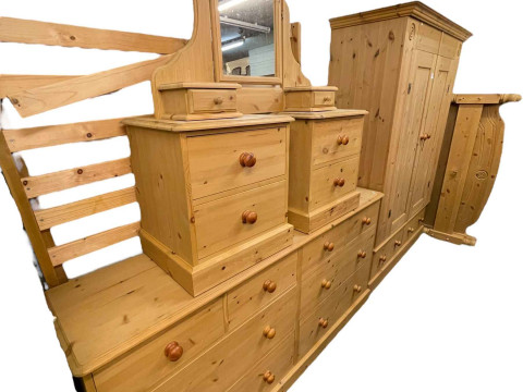 Six piece pine bedroom suite comprising two door wardrobe with two base drawers, 199cm by 146cm by 56cm, chest of four short above four long drawers, 89cm by 185cm by 43.5cm, pair two drawer pedestals, dressing mirror and double bedstead. thumbnail