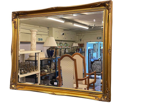 Oval twin pedestal extending dining table with integral leaf, set of six chairs including pair carvers and gilt framed bevelled wall mirror. thumbnail