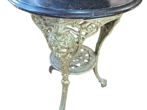 Circular cast base pub table, 70cm by 56cm diameter.