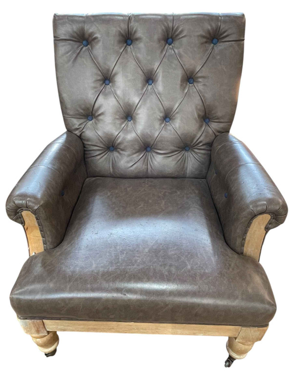 Andrew Martin designer button backed leather armchair.