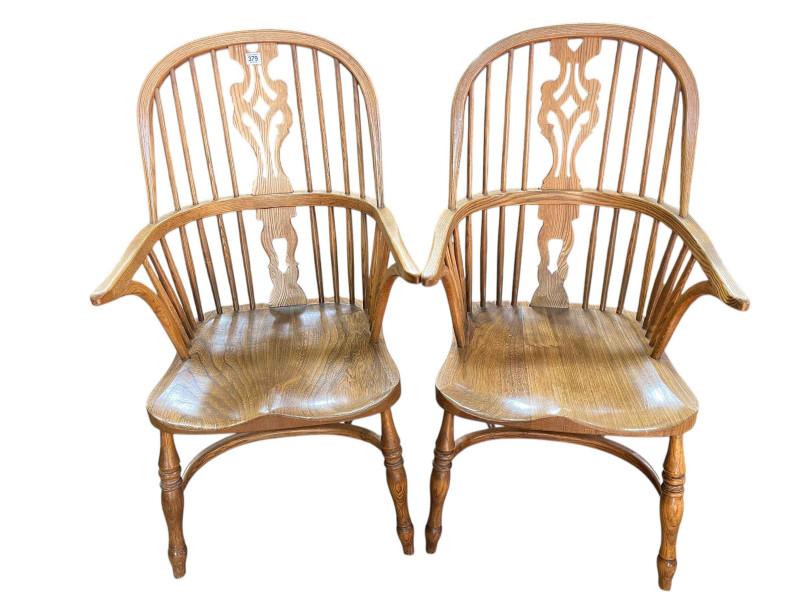 Pair Windsor pierced splat back elbow chairs with crinoline stretchers.