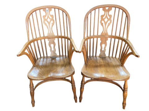 Pair Windsor pierced splat back elbow chairs with crinoline stretchers.