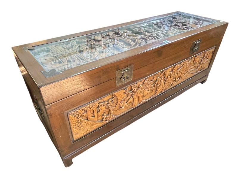 Large carved camphorwood trunk with inset glazed top, 61cm by 152cm by 50cm.