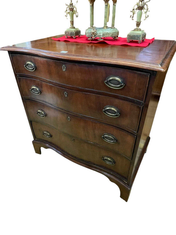 19th Century mahogany serpentine front chest of four long drawers on bracket feet, 91cm by 89cm by 57cm.
