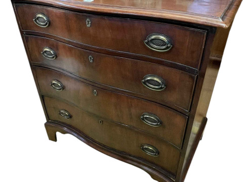 19th Century mahogany serpentine front chest of four long drawers on bracket...