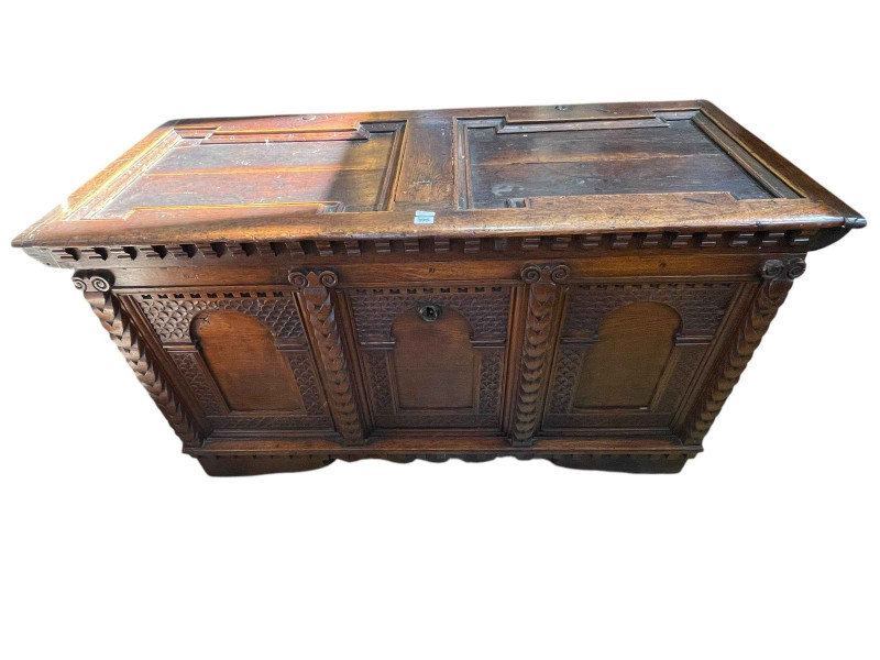 Antique carved oak triple arched panel front kist, 78cm by 141cm by 61cm.