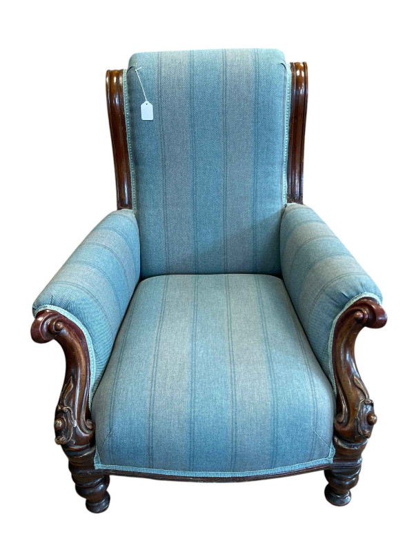 Victorian mahogany framed armchair on turned legs.