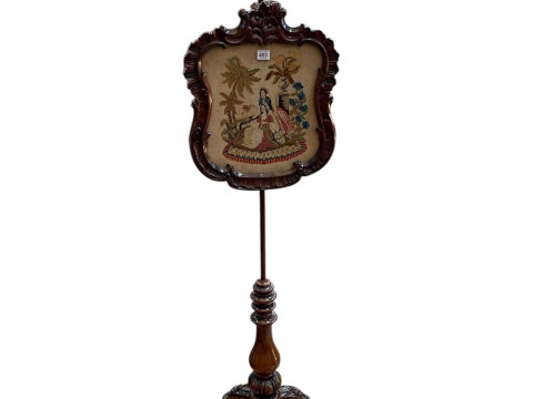 Victorian carved rosewood triform pole screen with glazed needlework panel,...