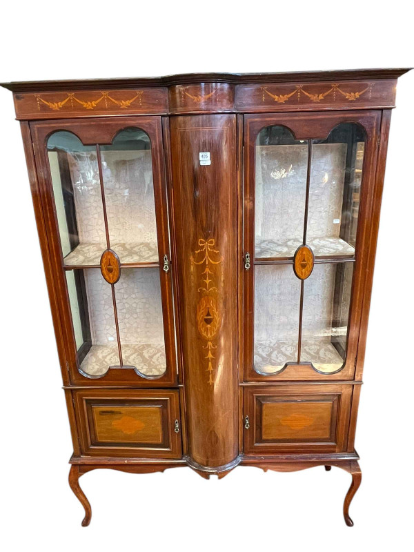 Edwardian inlaid mahogany vitrine having two glazed panel doors above two cupboard doors on cabriole legs, 181cm by 125cm by 43cm.