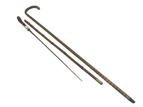 Bamboo style sword stick and a silver tipped walking stick. thumbnail
