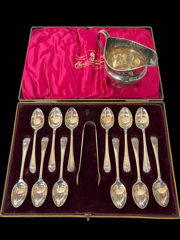 Cased set of twelve silver teaspoons and tongs, Sheffield 1899, and George III silver cream jug (2).