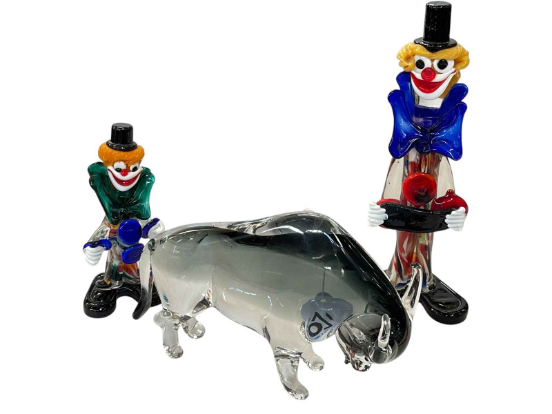 Two Murano clowns and a Baccarat glass bull.