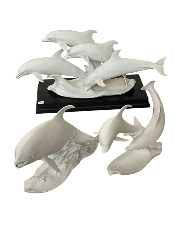 Three Kaiser Dolphin and Whale figures including two limited edition.