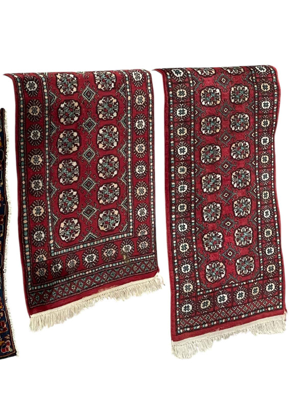 Two similar Pakistani hand knotted wool runners, longest 2.45 by 0.79.
