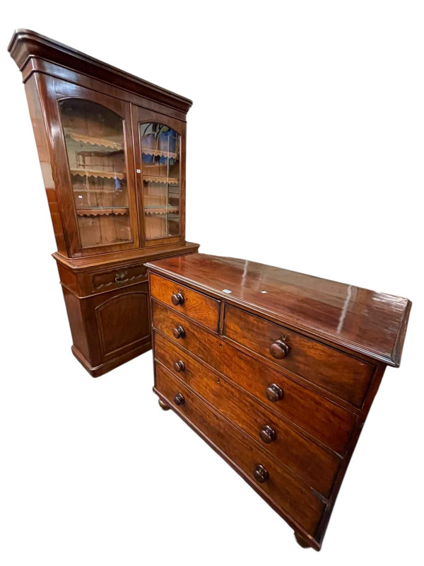 Victorian mahogany four door cabinet bookcase, 217cm by 122cm by 48cm, and Victorian mahogany chest of two short above three long drawers, 106.5cm by 111cm by 52cm.